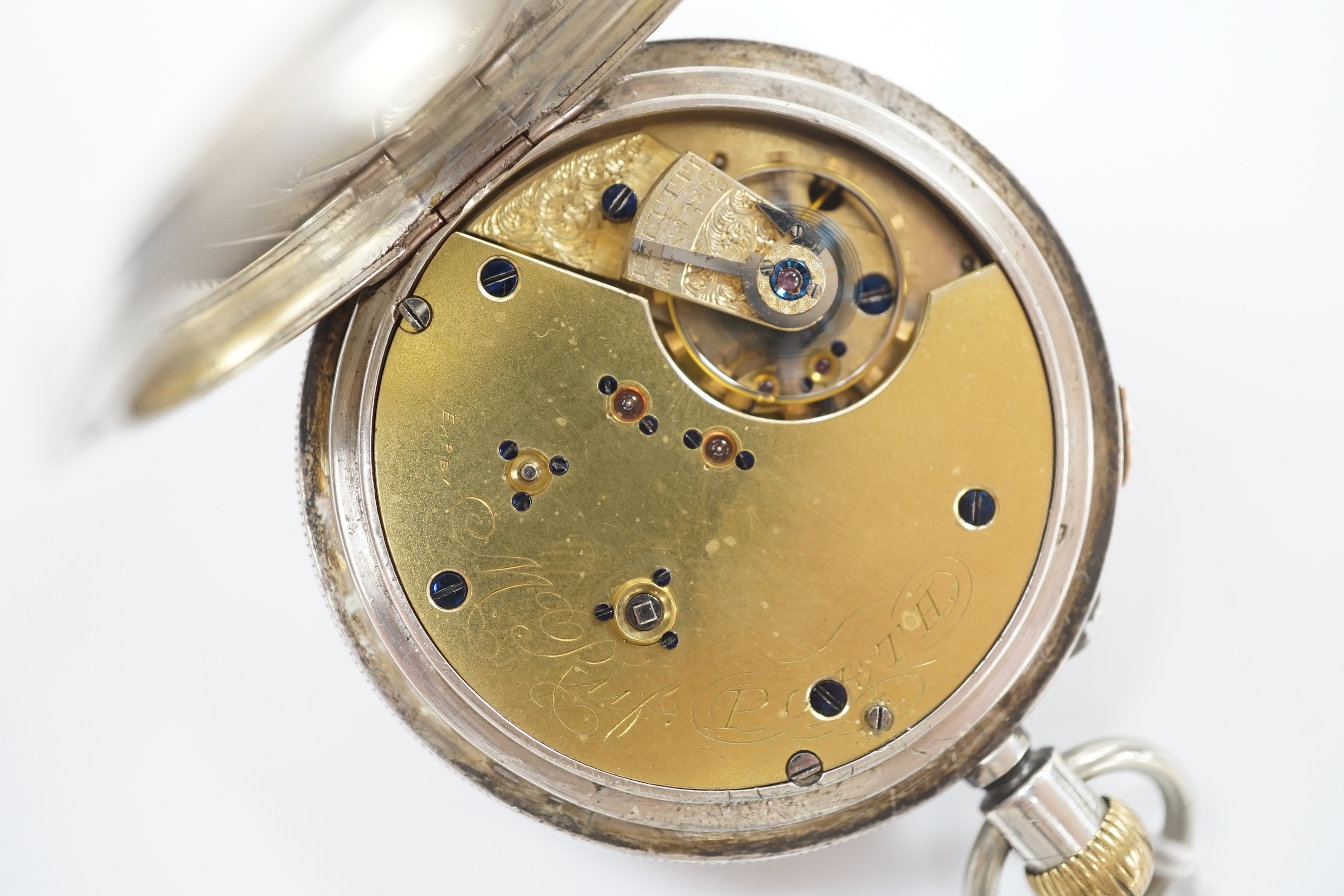 A Swiss white metal cased open faced chronograph pocket watch, by M. Ruff, Porth, with Roman dial.